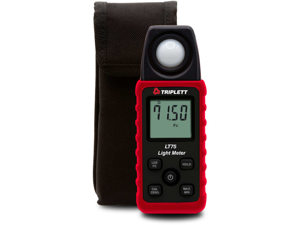 Red LT75 light meter with sensor dome on top and black keypad, shown with a dark carrying pouch behind it for scale and storage.