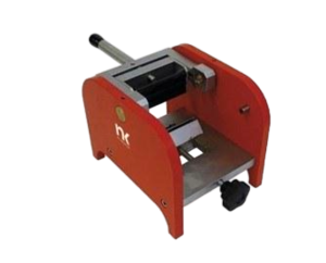 Red manual press tool with silver metal frame and black handle, shown from the side